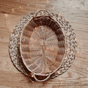 Oval vintage wicker like platter basket with handles.